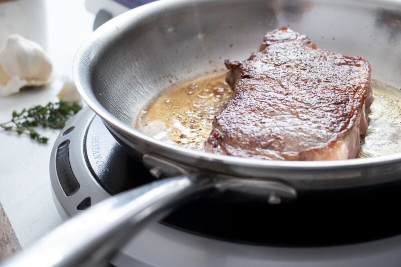 Cooking Steak in a Stainless Steel Pan