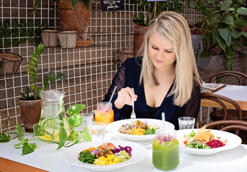 Woman eating her raw vegan breakfast