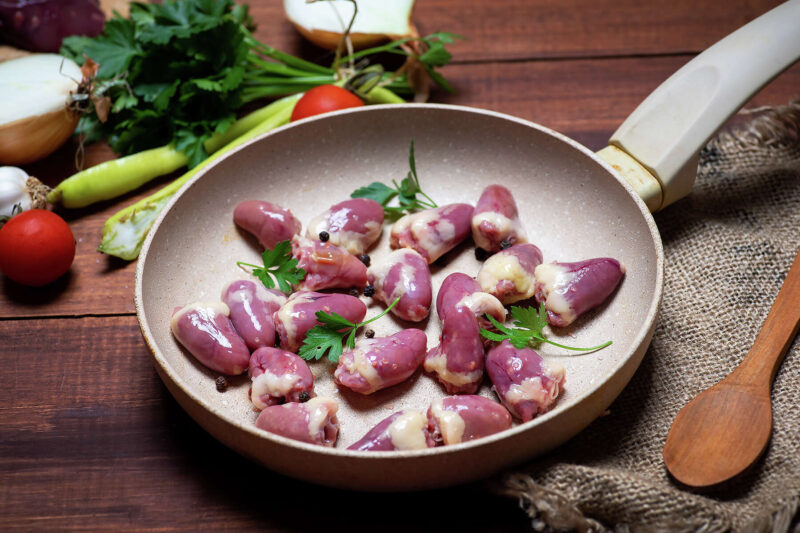 Sauteeing Beef Kidneys in A Ceramic Pan. Concept for Pros and Cons of Ceramic Cookware